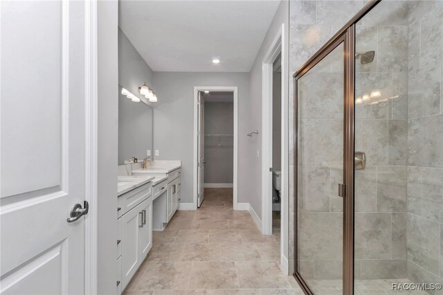 7024 N Fountainhead Dr, Citrus Springs, FL 34433 - bathroom with double vanity, a stall shower, a spacious closet, and recessed lighting
