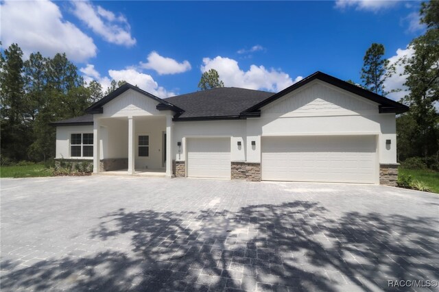 7024 N Fountainhead Dr, Citrus Springs, FL 34433 - ranch-style home featuring stone siding, decorative driveway, a garage, and stucco siding