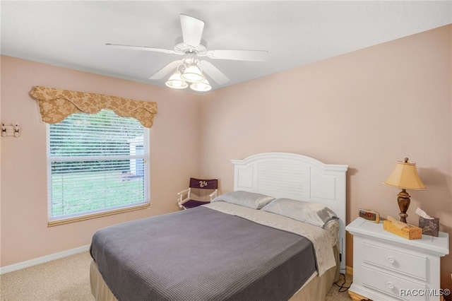 2617 E Newhaven St, Inverness, FL 34453 - bedroom featuring multiple windows, light colored carpet, baseboards, and a ceiling fan