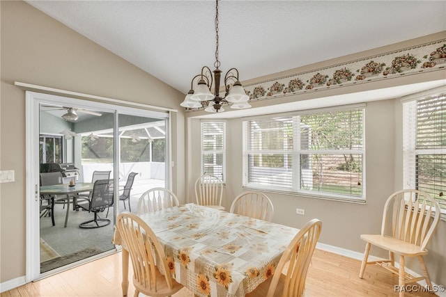 2617 E Newhaven St, Inverness, FL 34453 - dining area with light wood-style floors, vaulted ceiling, baseboards, and a chandelier