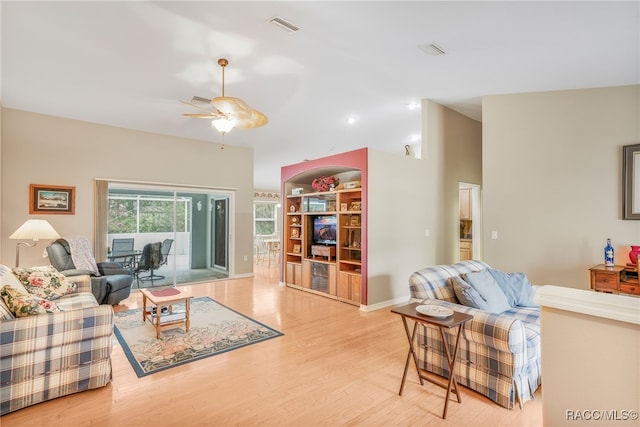 2617 E Newhaven St, Inverness, FL 34453 - living room with ceiling fan, wood finished floors, and baseboards
