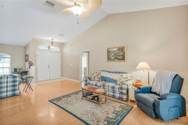 2617 E Newhaven St, Inverness, FL 34453 - living area featuring a ceiling fan, high vaulted ceiling, wood finished floors, and baseboards