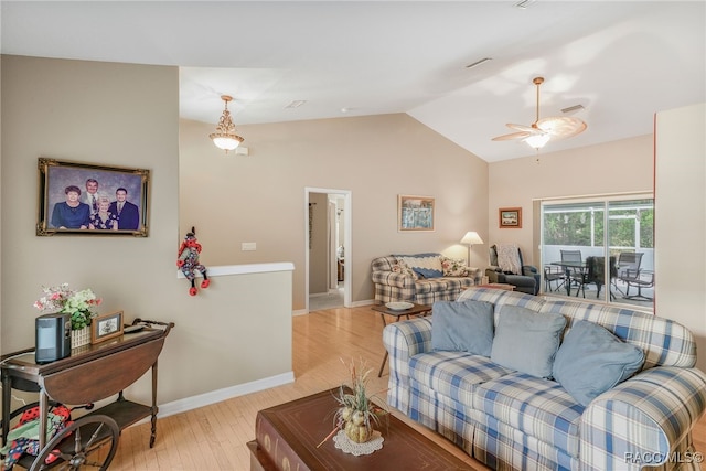 2617 E Newhaven St, Inverness, FL 34453 - living area with vaulted ceiling, light wood-style floors, baseboards, and a ceiling fan