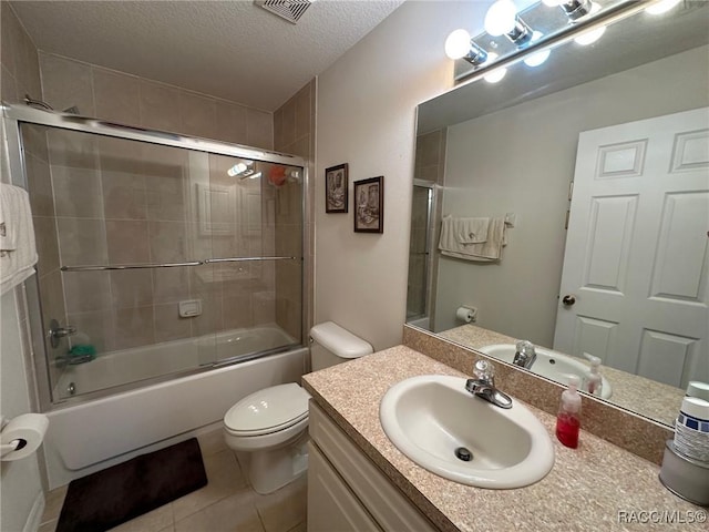 bathroom featuring enclosed tub / shower combo, tile patterned flooring, a textured ceiling, toilet, and visible vents