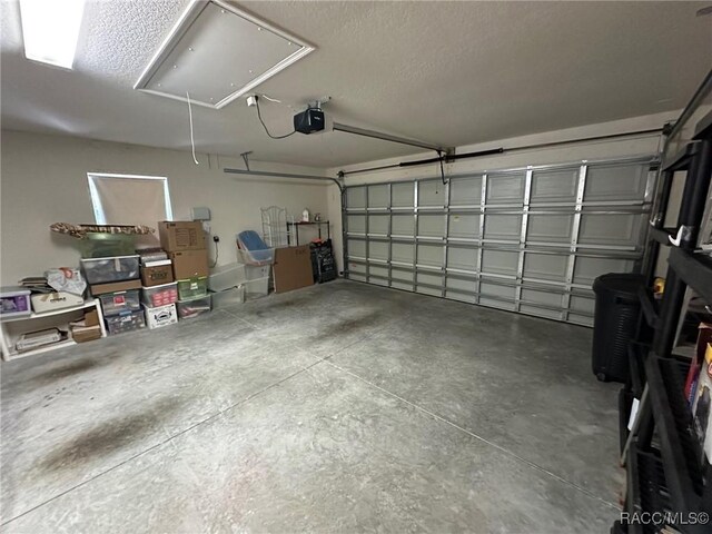 garage featuring a garage door opener