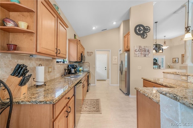 kitchen with sink, stainless steel appliances, light stone counters, a chandelier, and pendant lighting