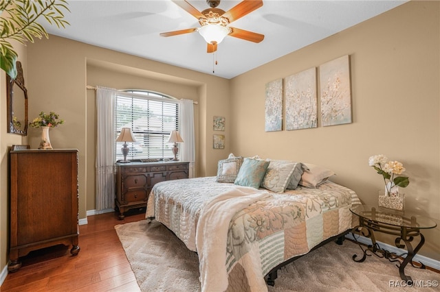 bedroom featuring ceiling fan and hardwood / wood-style flooring