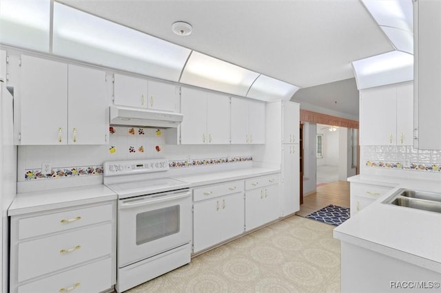 kitchen featuring white cabinets, electric stove, light countertops, under cabinet range hood, and a sink