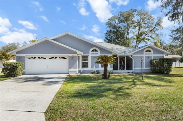 ranch-style home featuring a garage, driveway, a front lawn, and stucco siding