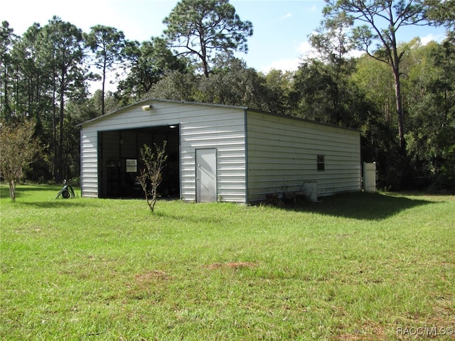 view of outbuilding featuring a lawn