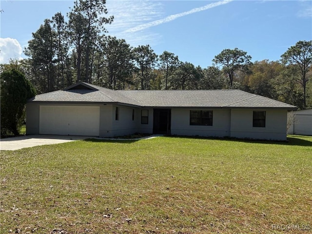 single story home featuring a garage and a front lawn