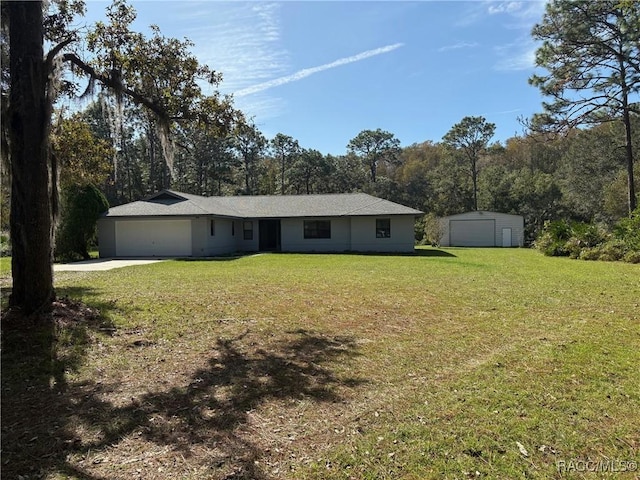 ranch-style home with a garage and a front yard