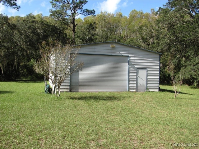 garage featuring a lawn