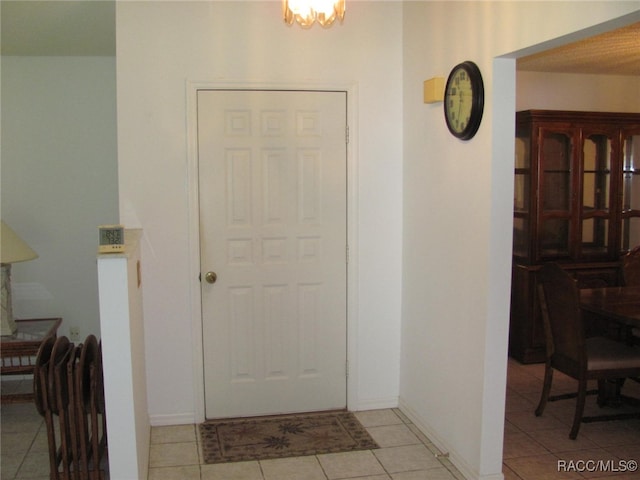 entryway with light tile patterned floors