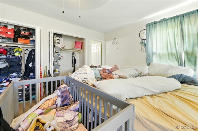 bedroom featuring two closets