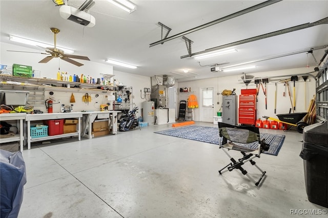 garage featuring a workshop area, a garage door opener, ceiling fan, water heater, and heating unit