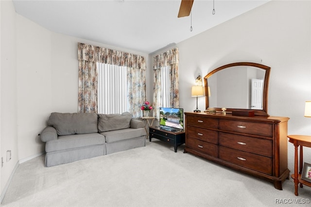 sitting room with light carpet and ceiling fan