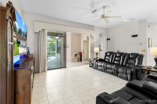 tiled living room featuring ceiling fan