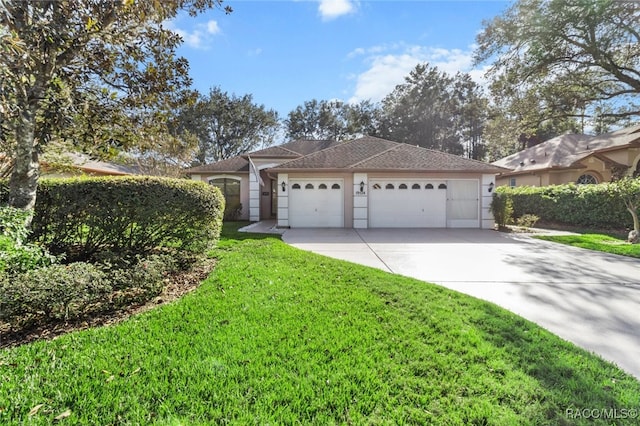 ranch-style home featuring a front yard and a garage