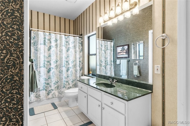 bathroom featuring tile patterned floors, vanity, and toilet