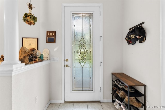 tiled entryway with ornate columns