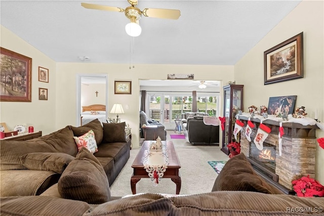 living room featuring ceiling fan and light colored carpet