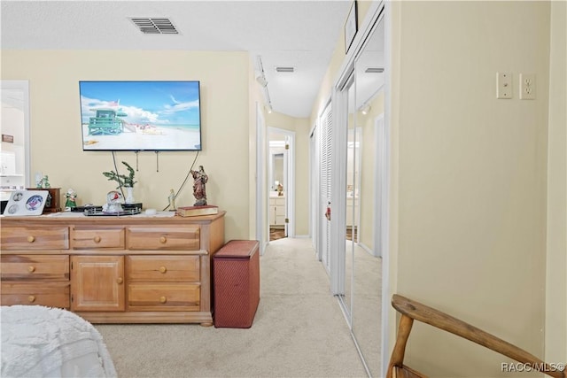 bedroom with light colored carpet