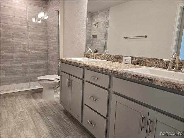 279 Bittern Loop, Inverness, FL 34453 - full bath featuring toilet, double vanity, a sink, and a stall shower