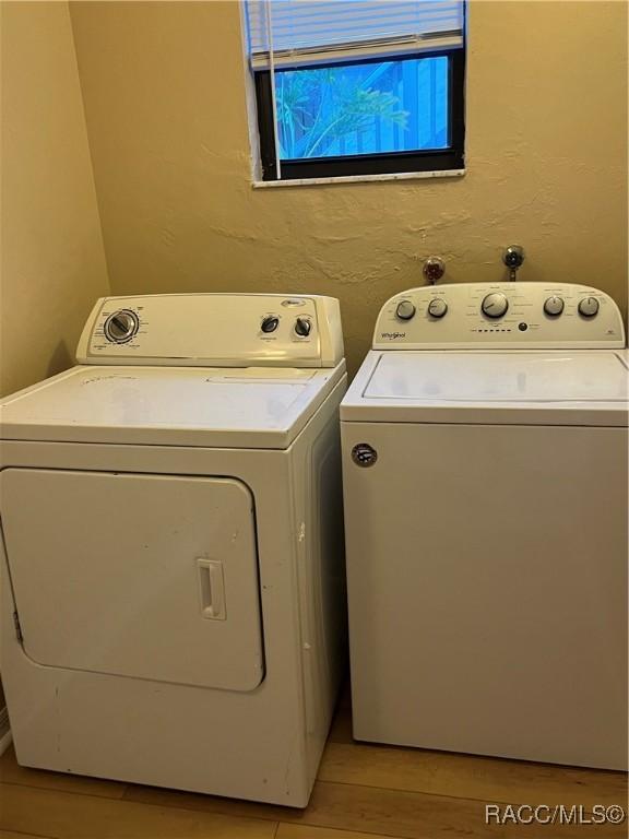 laundry room with separate washer and dryer