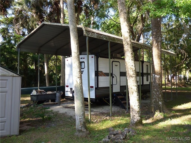 view of shed with a carport