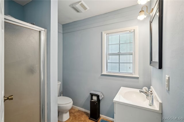 full bath featuring vanity, toilet, tile patterned floors, visible vents, and a stall shower