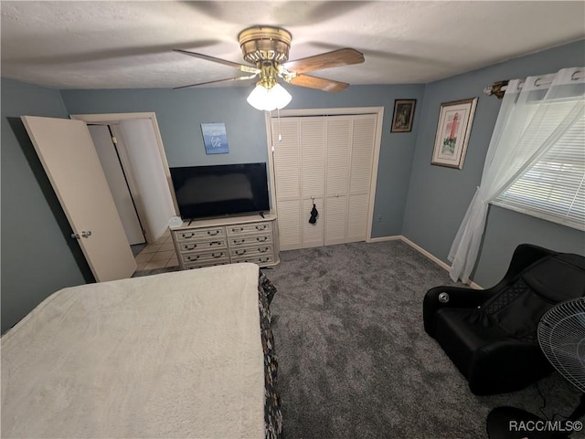 carpeted bedroom featuring a ceiling fan and baseboards