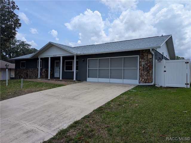single story home featuring a garage, stone siding, concrete driveway, a porch, and a gate