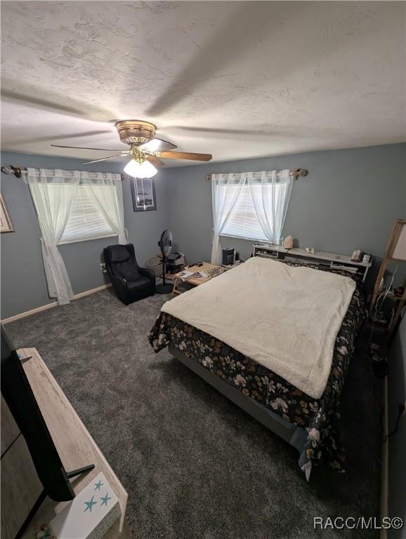 bedroom featuring carpet floors and ceiling fan