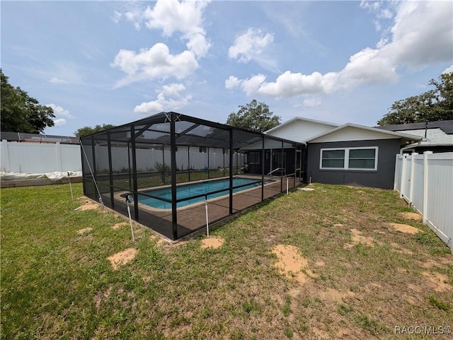 view of swimming pool with a lanai
