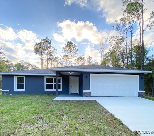 view of front of home featuring a garage, concrete driveway, stone siding, stucco siding, and a front yard