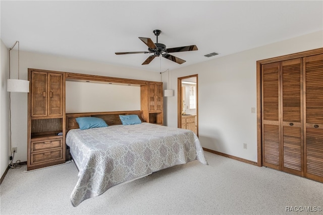 carpeted bedroom featuring ceiling fan and connected bathroom