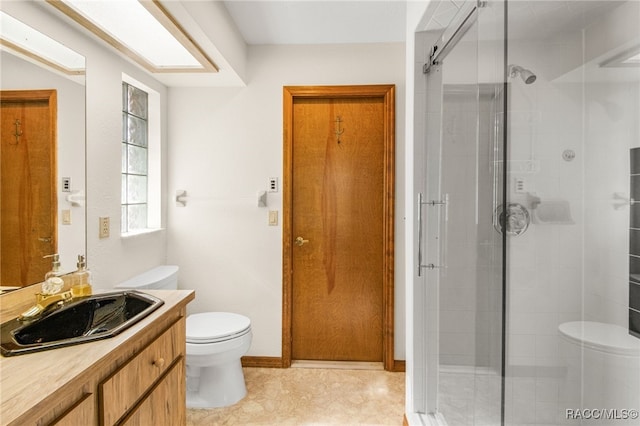 bathroom featuring toilet, an enclosed shower, and vanity