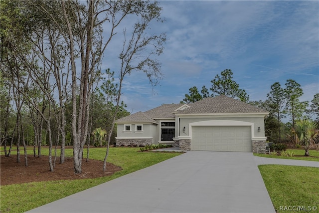 view of front of home featuring a front yard and a garage