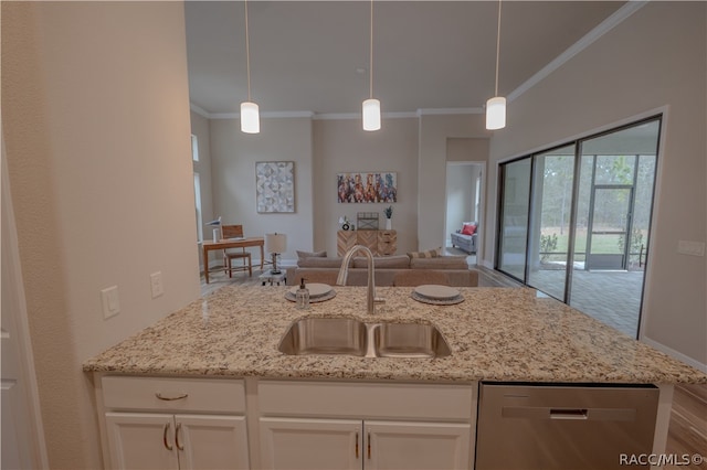 kitchen featuring stainless steel dishwasher, light stone counters, sink, and hanging light fixtures