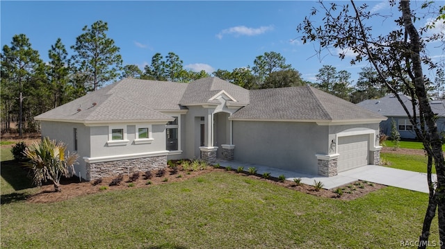 view of front of property with a front yard and a garage