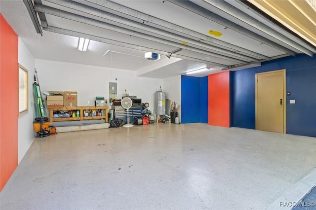 garage featuring a garage door opener and water heater