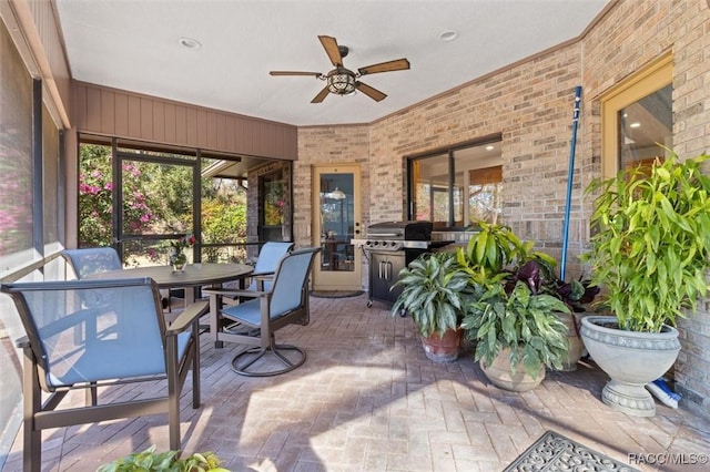 sunroom / solarium with ceiling fan