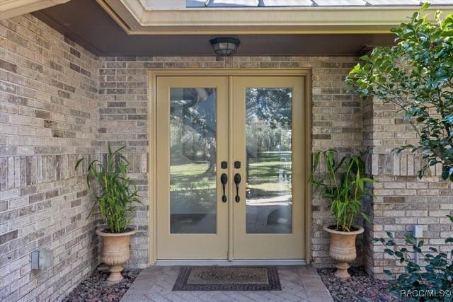 entrance to property featuring french doors