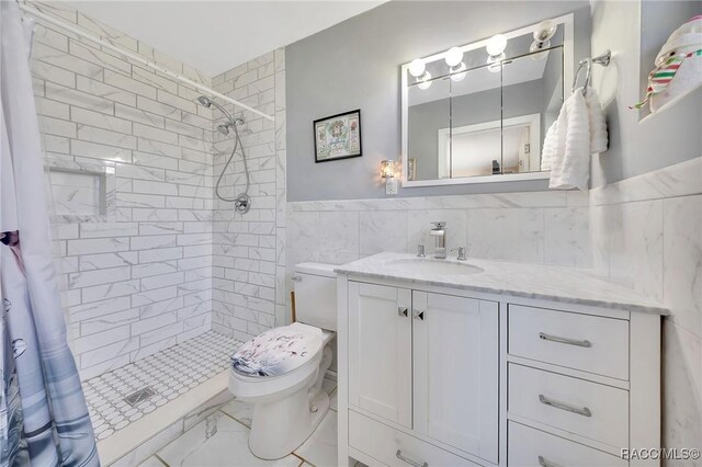 66 S Desoto St, Beverly Hills, FL 34465 - full bathroom with toilet, vanity, a tile shower, marble finish flooring, and tile walls