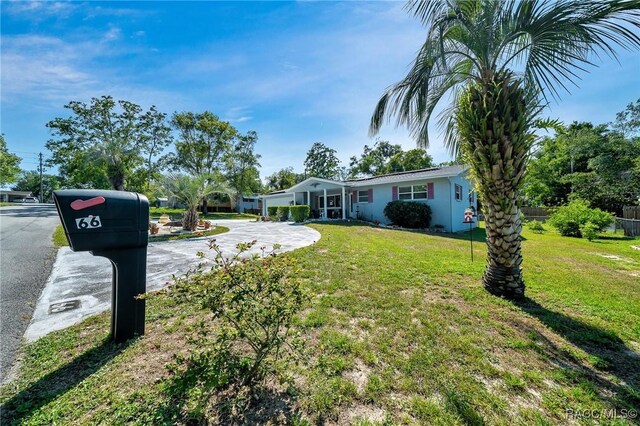 66 S Desoto St, Beverly Hills, FL 34465 - ranch-style home featuring a front lawn and driveway