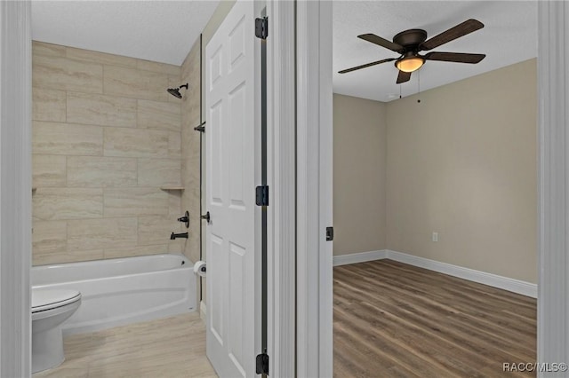 977 W Homeway Loop, Citrus Springs, FL 34434 - full bathroom featuring shower / tub combination, a ceiling fan, and wood finished floors