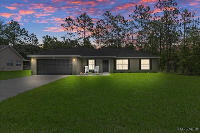 977 W Homeway Loop, Citrus Springs, FL 34434 - single story home featuring a garage, a yard, concrete driveway, and stucco siding