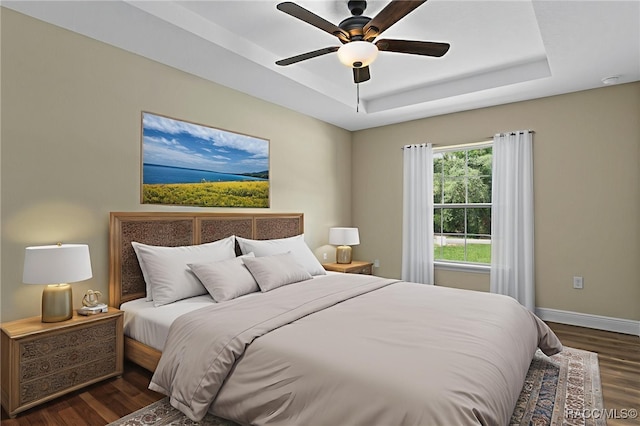 977 W Homeway Loop, Citrus Springs, FL 34434 - bedroom featuring dark wood-style flooring, a raised ceiling, and ceiling fan