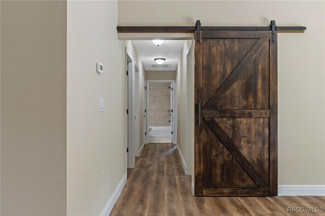977 W Homeway Loop, Citrus Springs, FL 34434 - hall featuring wood finished floors and a barn door
